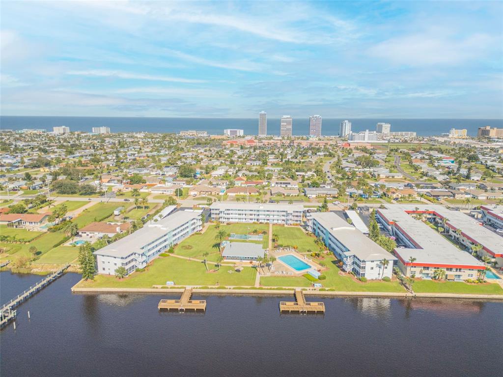 an aerial view of residential houses with outdoor space