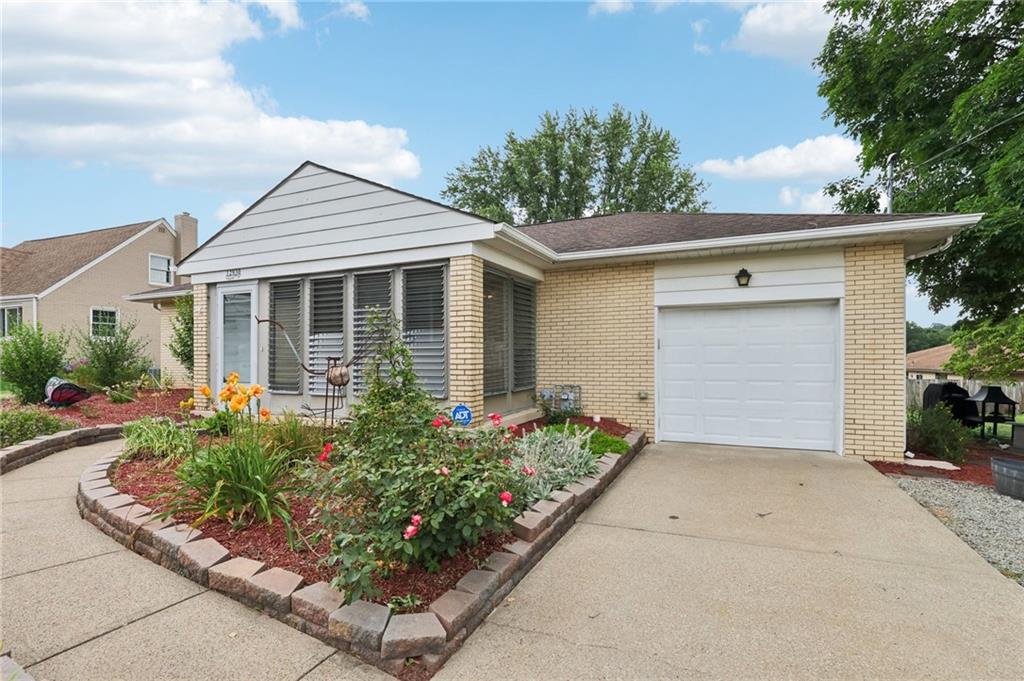 front view of a house with a small yard