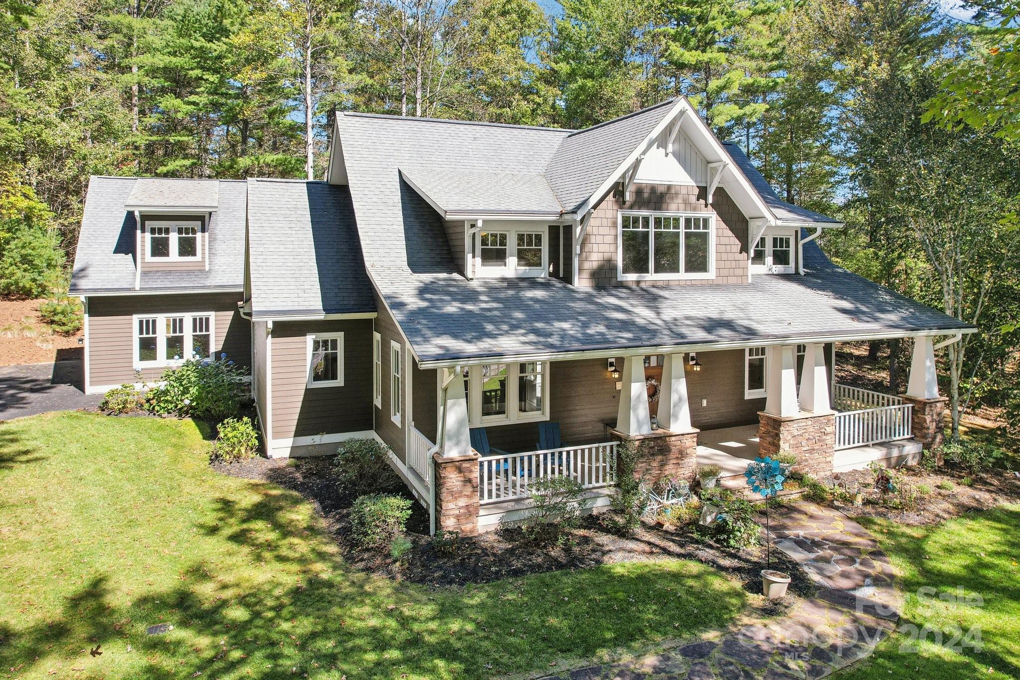 a aerial view of a house with a yard