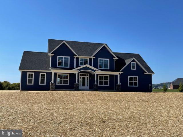 a front view of a house with large windows