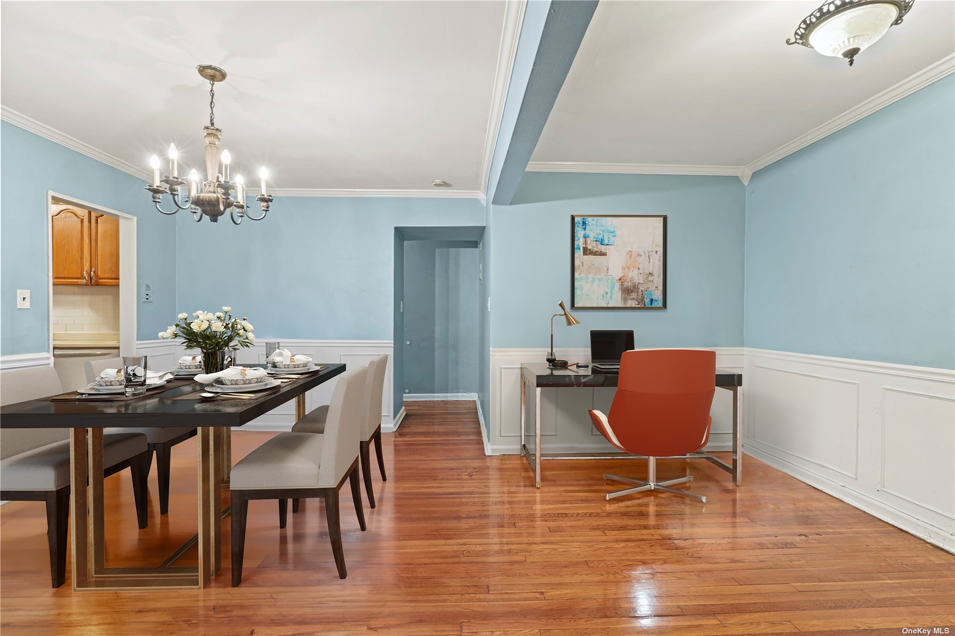 a view of a dining room with furniture and chandelier