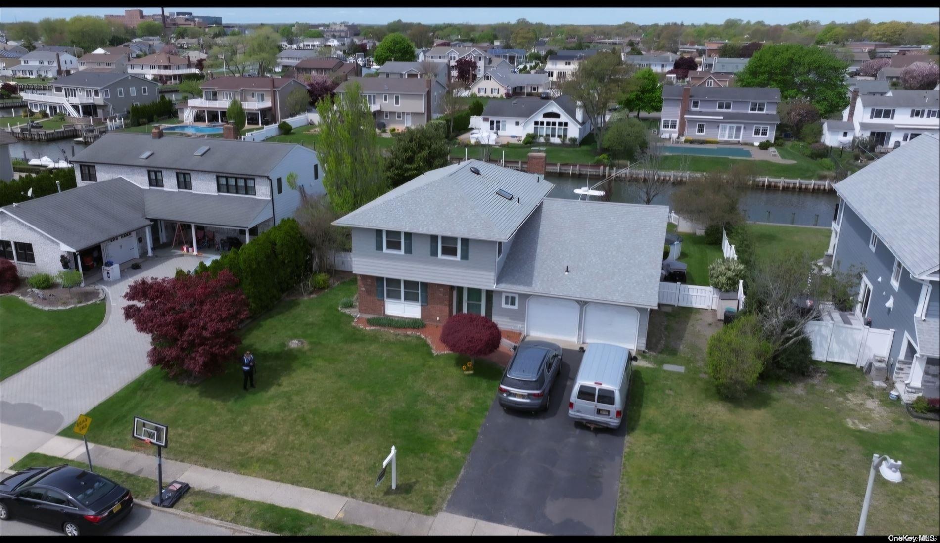 an aerial view of multiple houses with yard