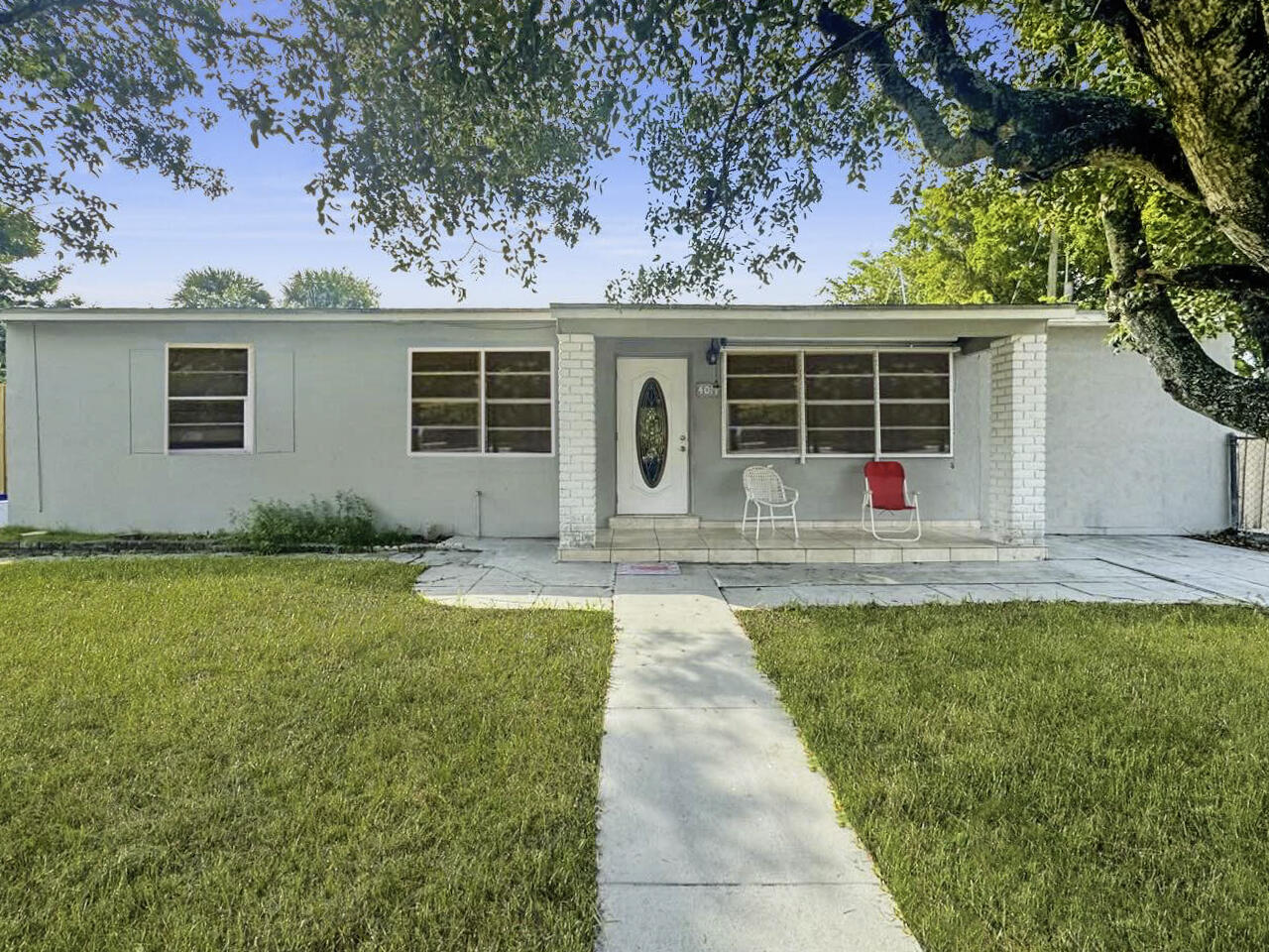 front view of a house with a yard