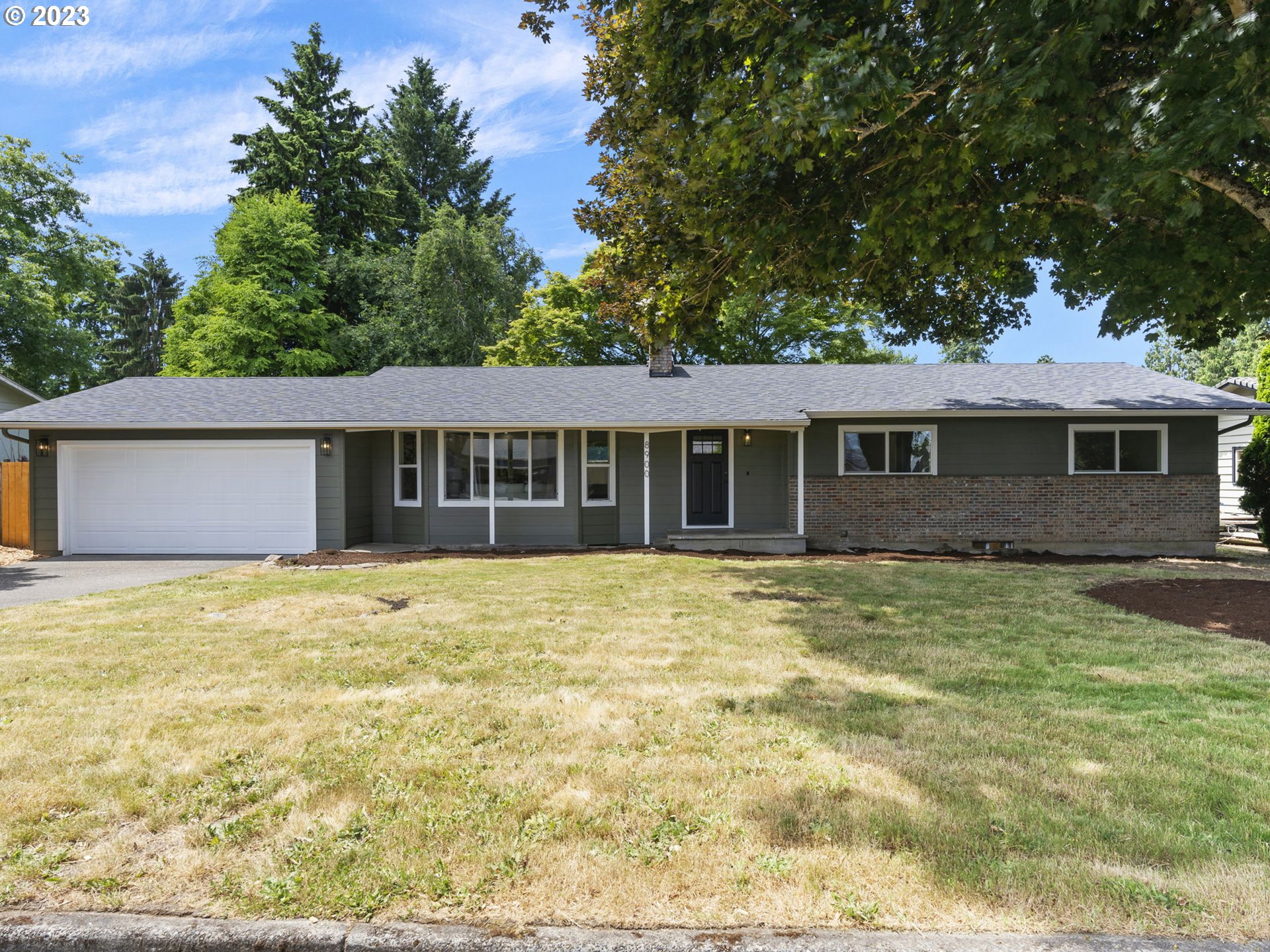 front view of a house with a yard