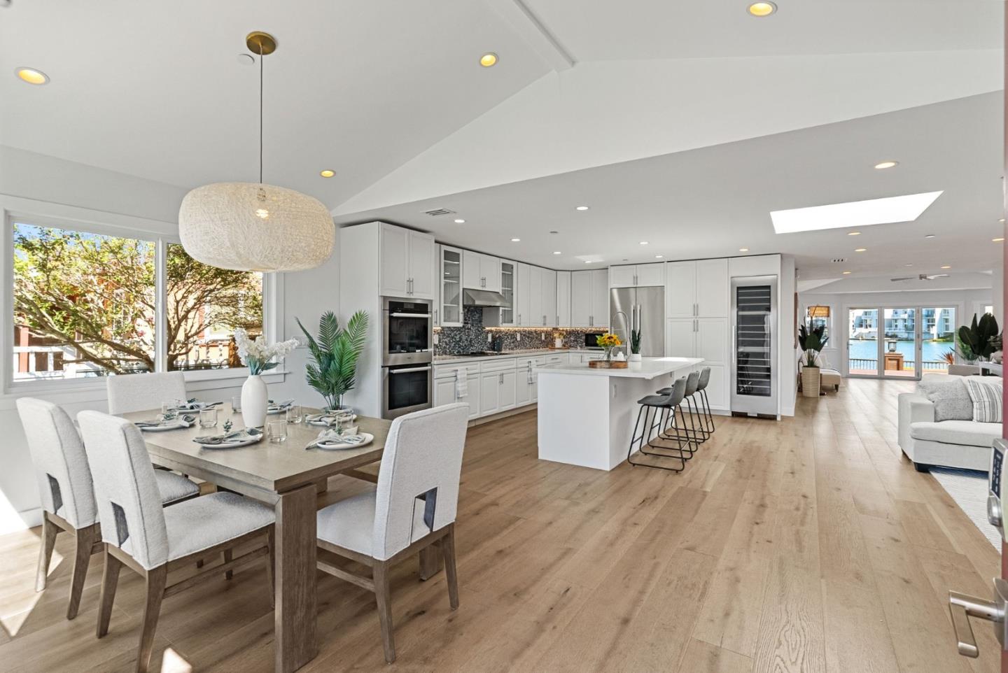 a living room with kitchen island furniture and a wooden floor