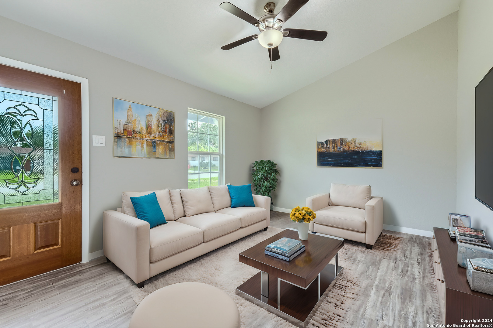 a living room with furniture and a large window