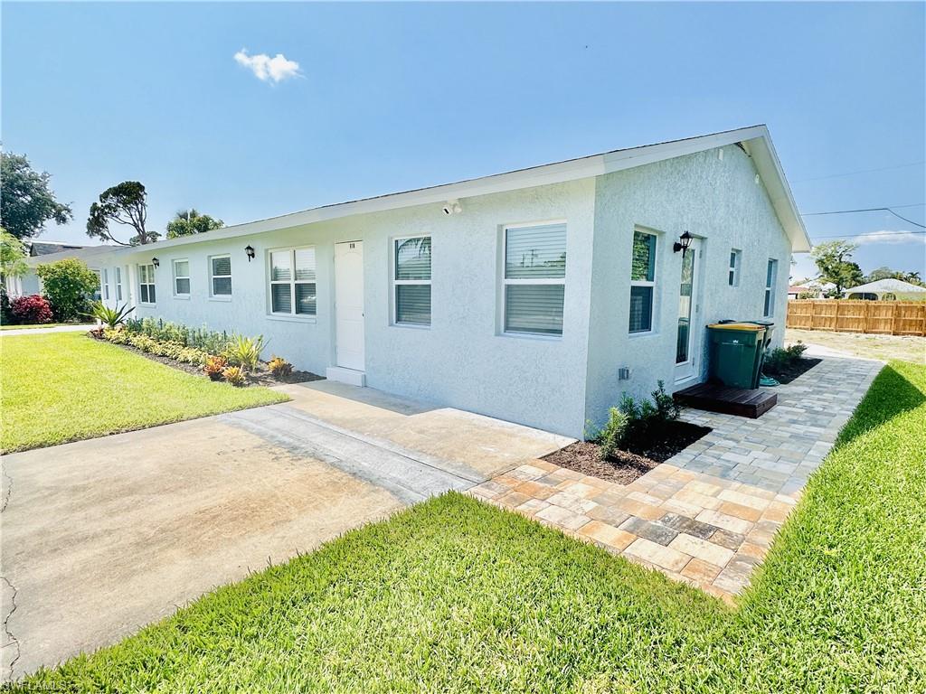 Ranch-style home featuring a front yard