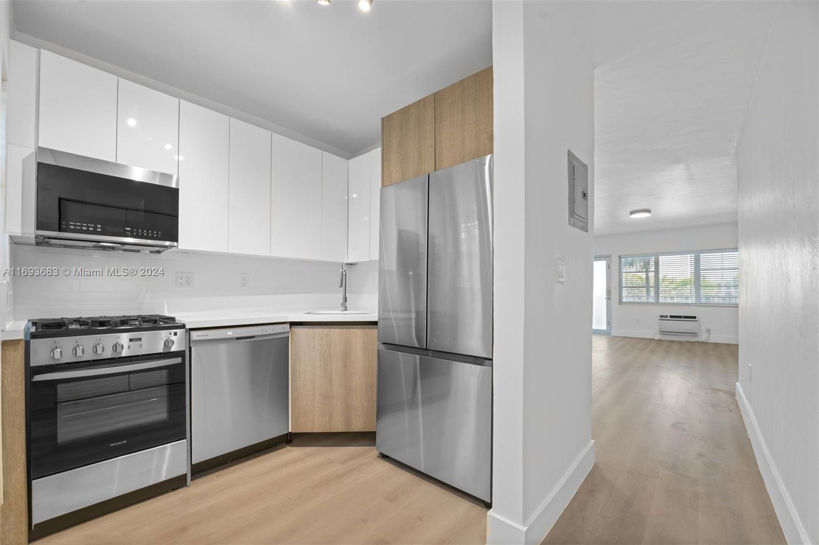 a kitchen with a refrigerator stove and microwave