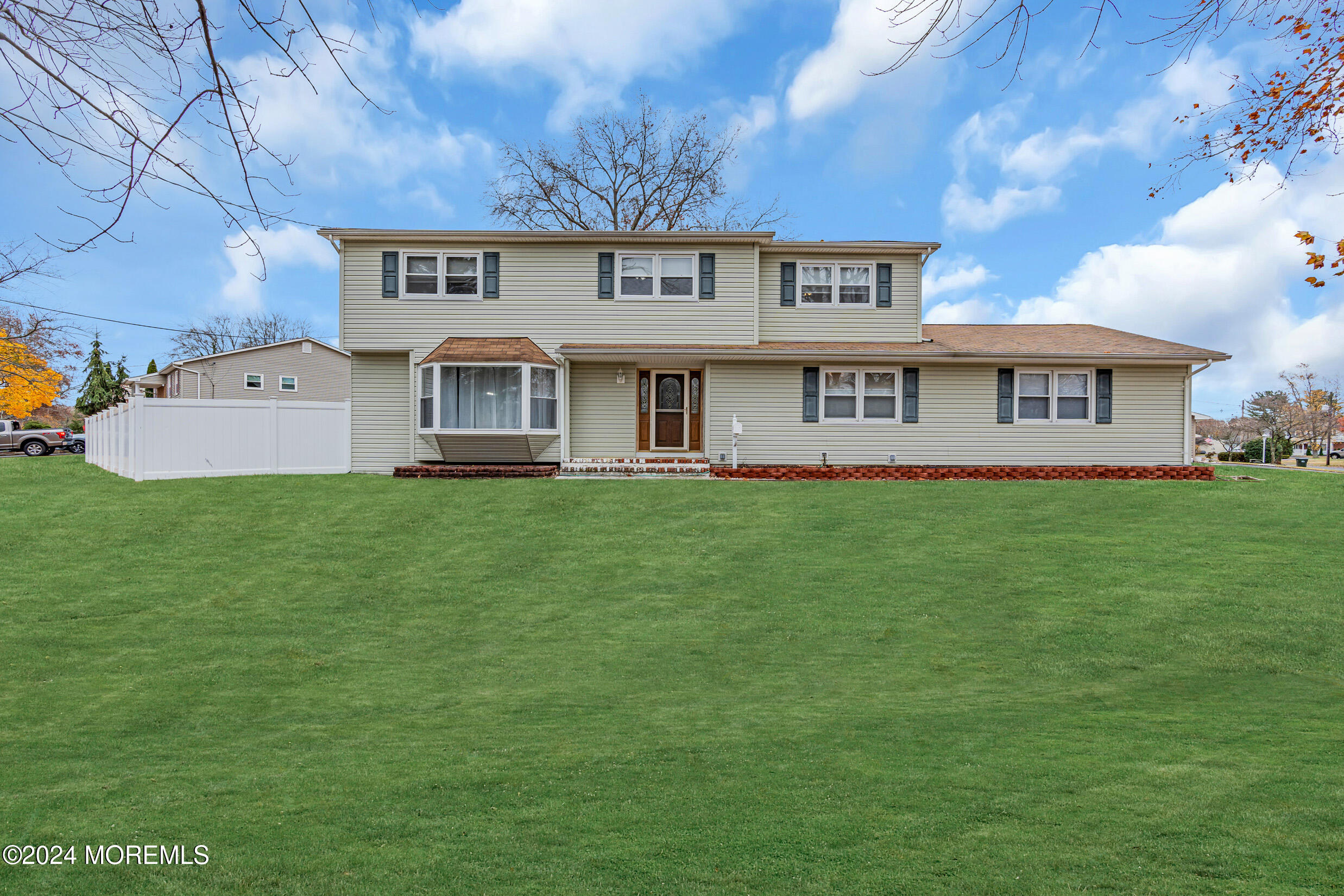 a view of a house with a big yard