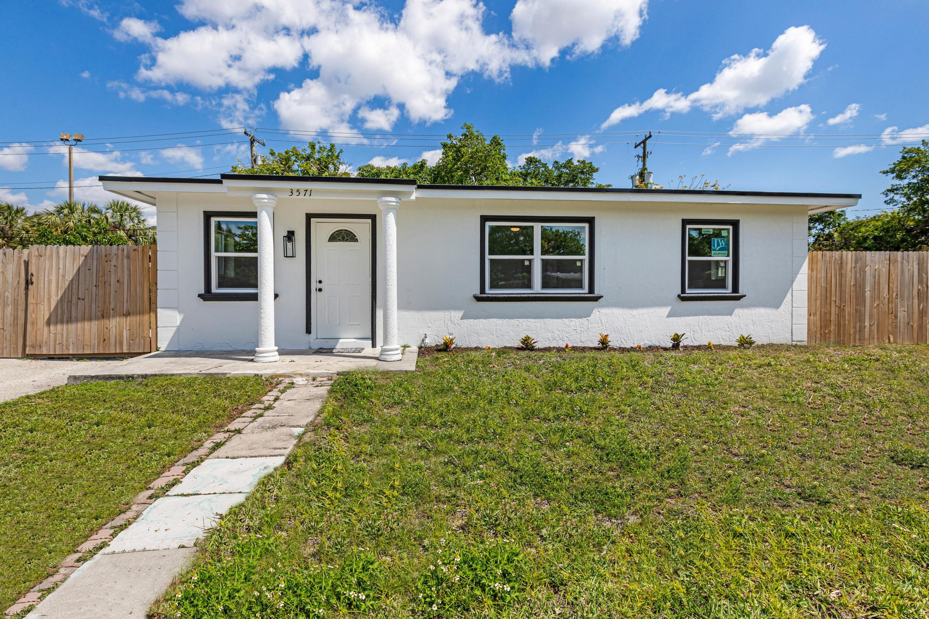 front view of a house with a yard