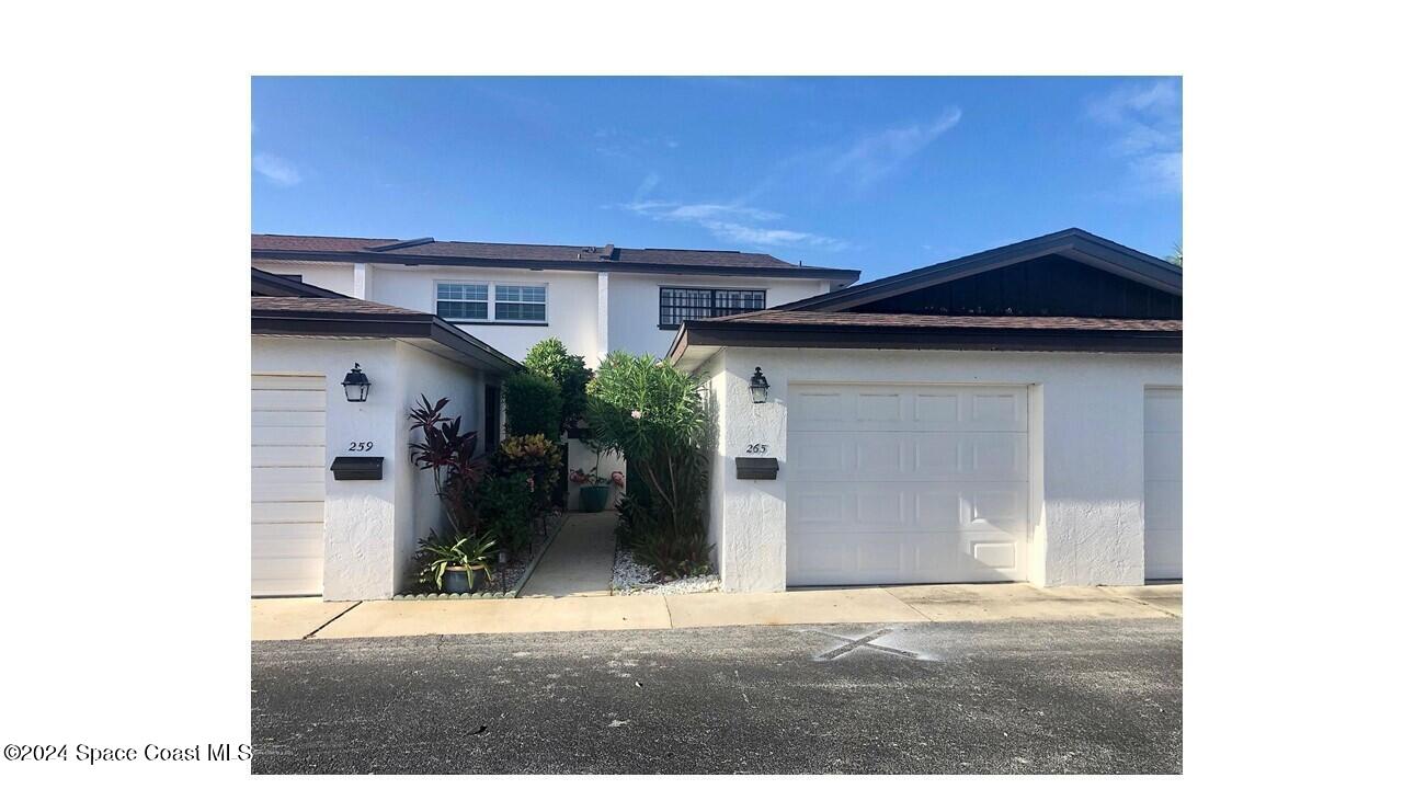 a view of a house with a garage