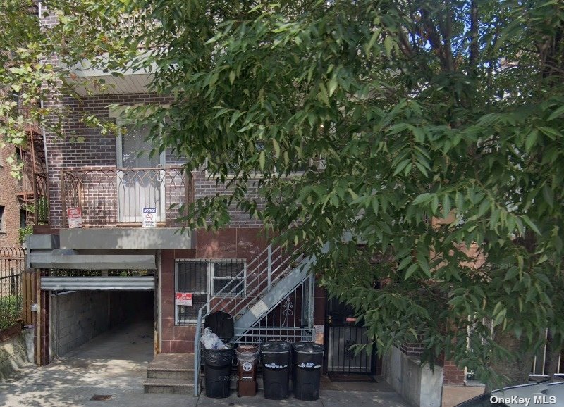 a view of house with roof deck and outdoor space