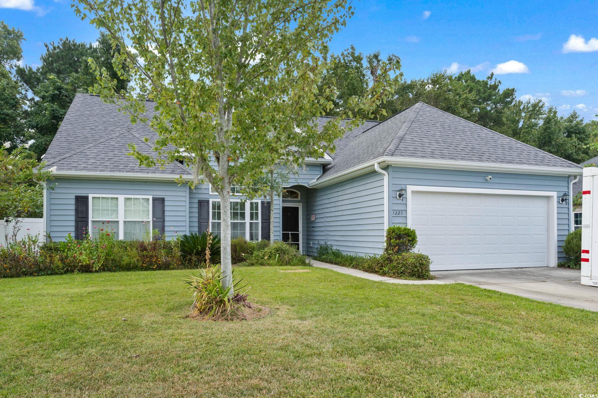 View of front of home featuring a front lawn and a