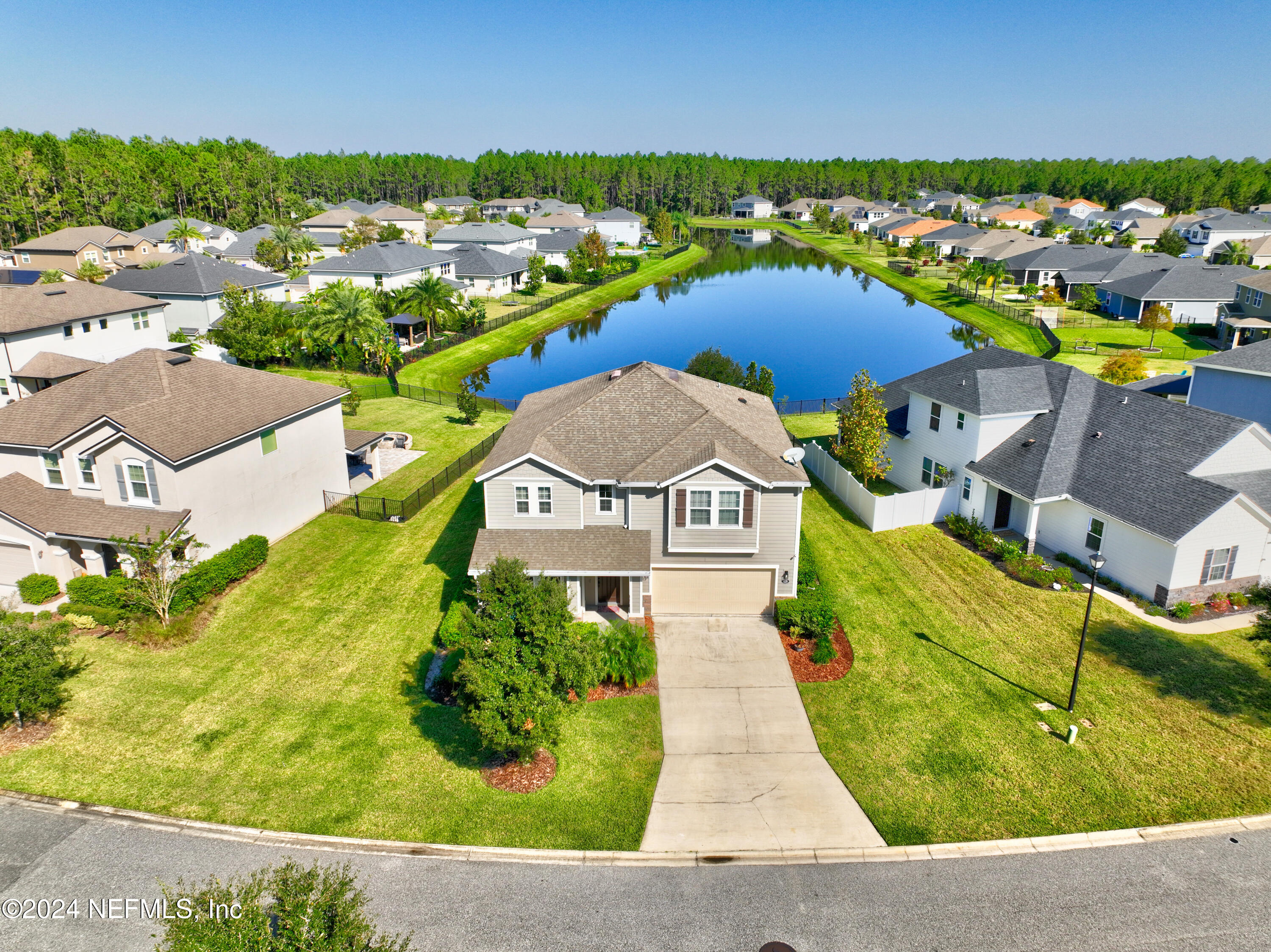 an aerial view of a house with a swimming pool yard and outdoor seating