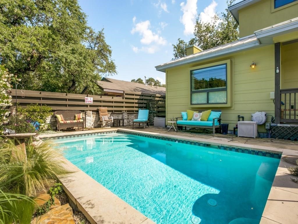 a view of a swimming pool with a patio