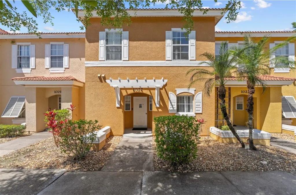 front view of a house with a fountain