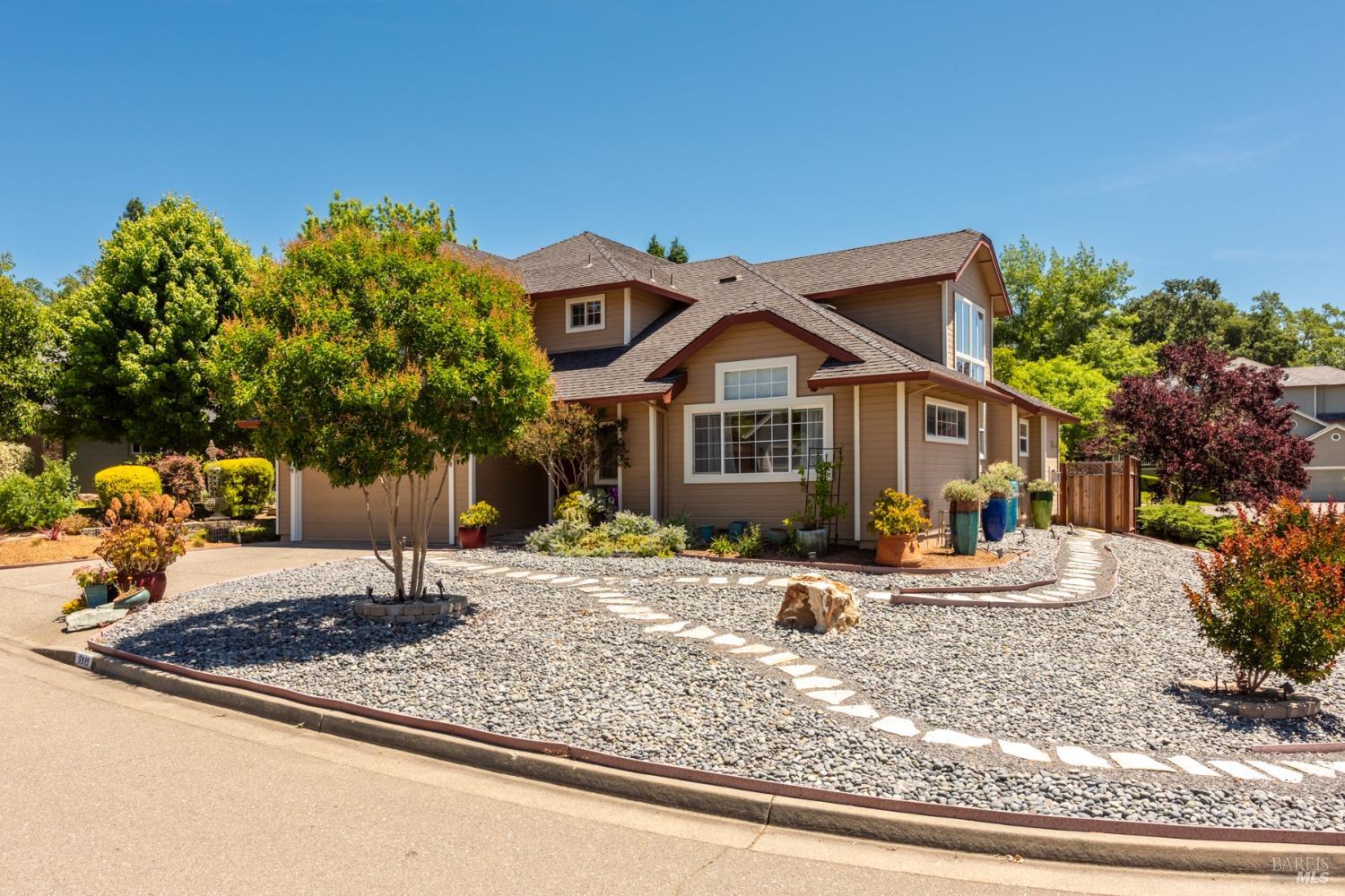 a front view of a house with garden