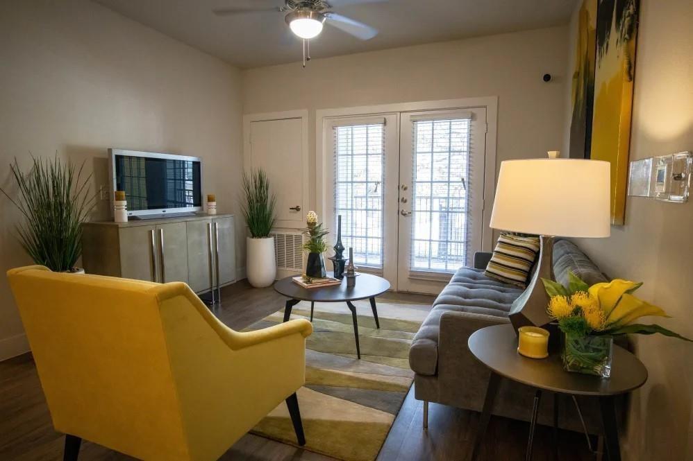 a living room with furniture and a flat screen tv