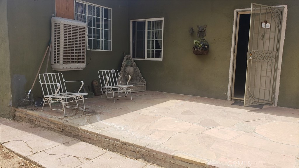 a patio with table and chairs