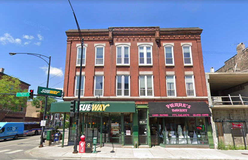 a front view of a building with street