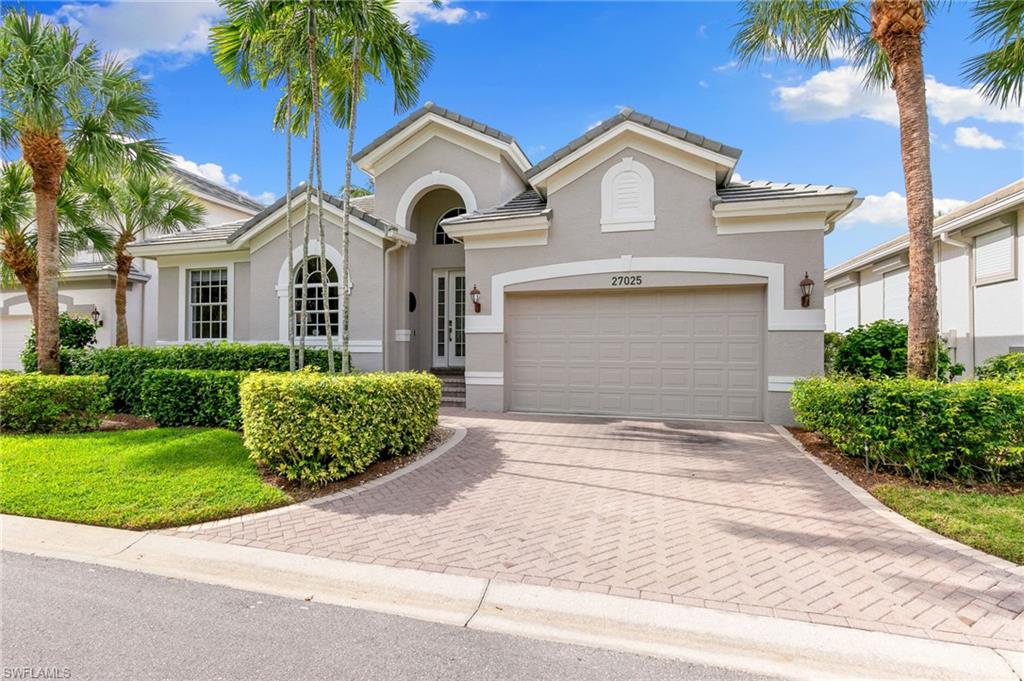 View of front of property with a garage