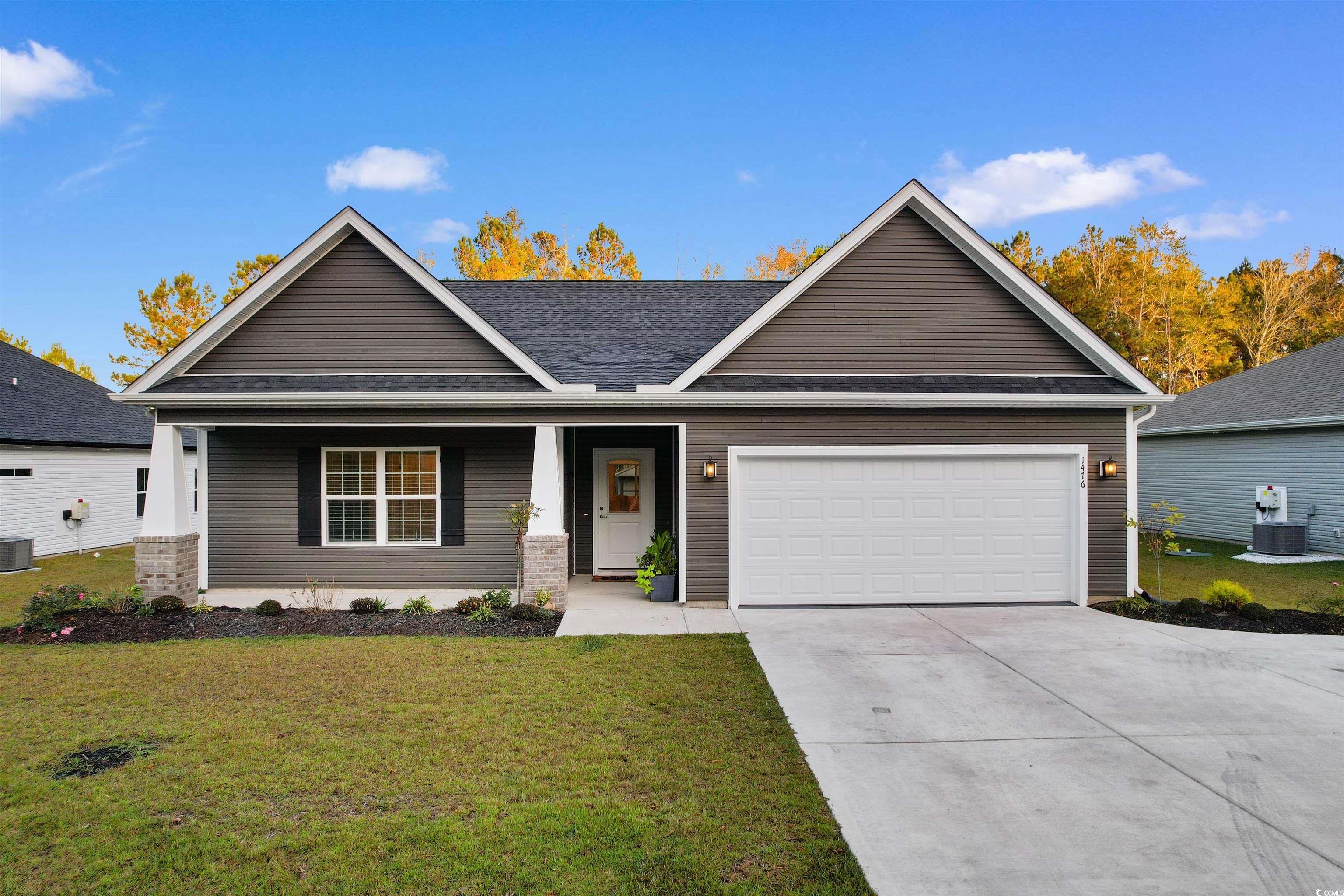 Craftsman-style home featuring central AC unit, a