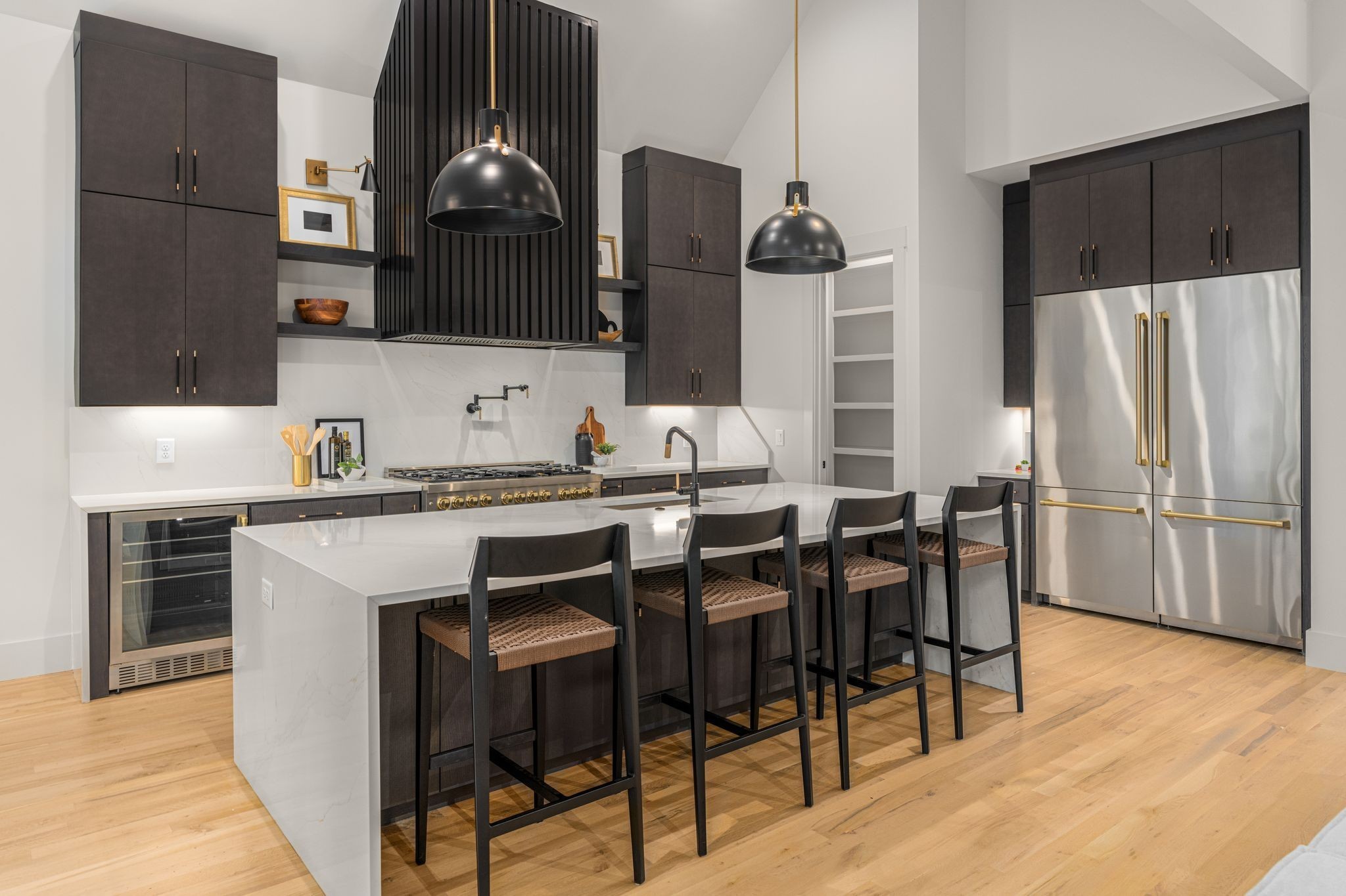 a kitchen with stainless steel appliances granite countertop a refrigerator and stove