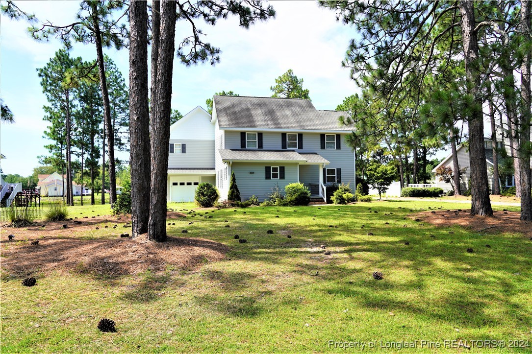 a view of a house with a big yard