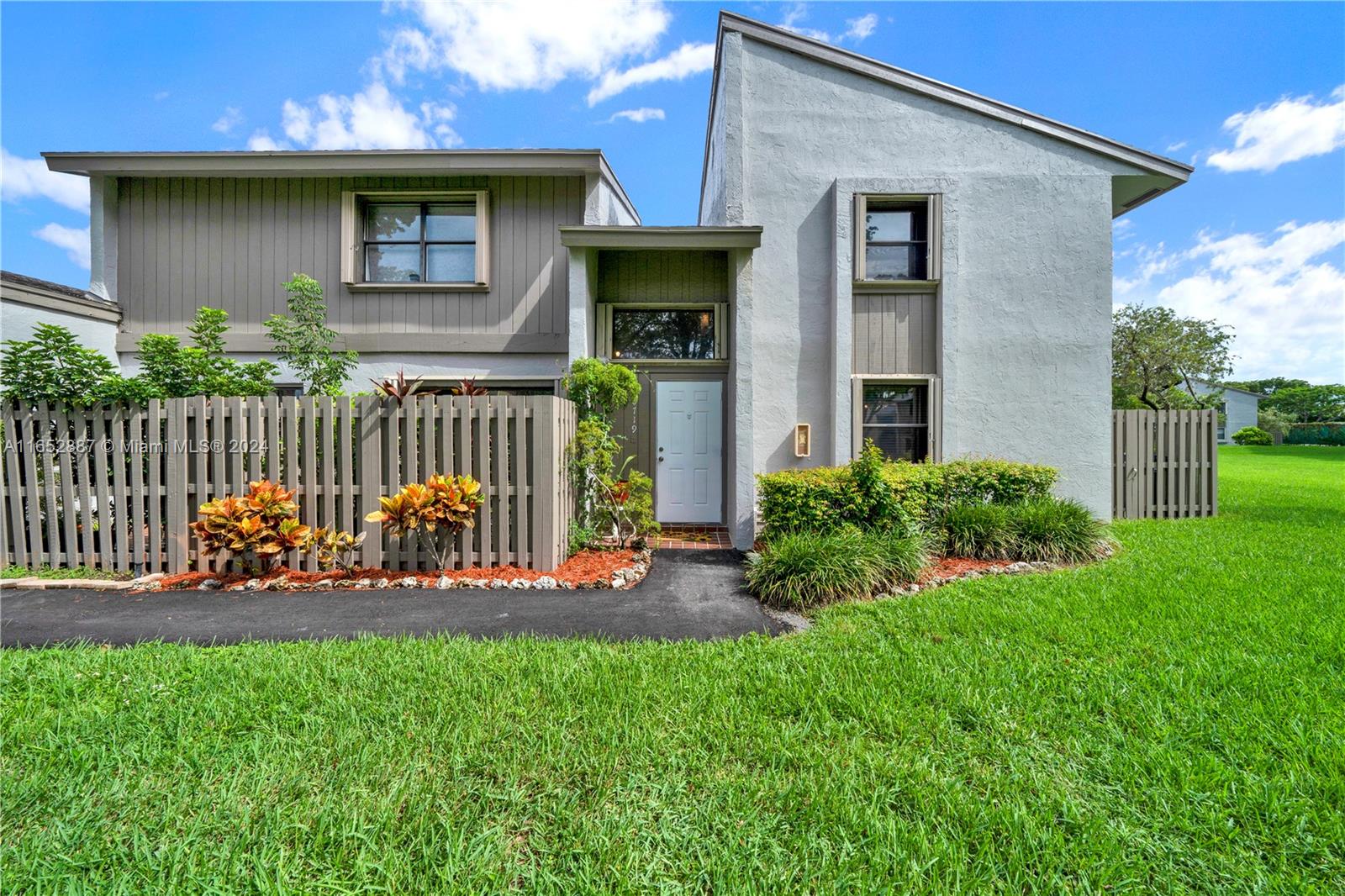 Beautiful corner lot unit with new fence.