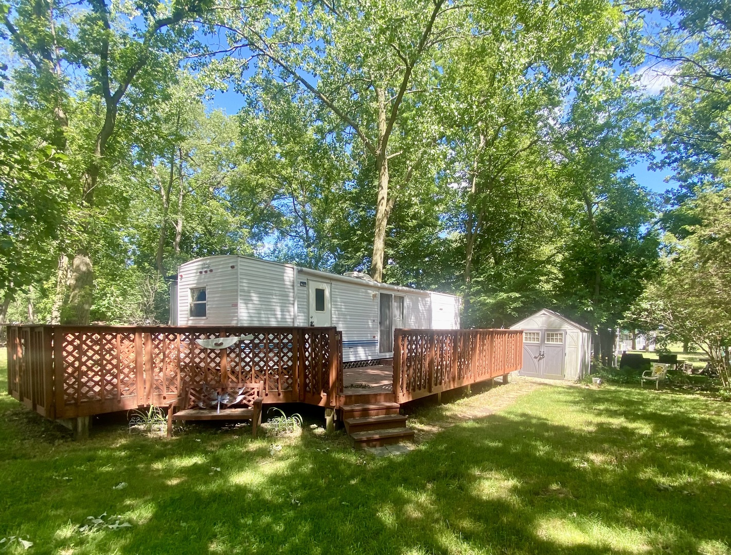 a view of a house with a yard and sitting area