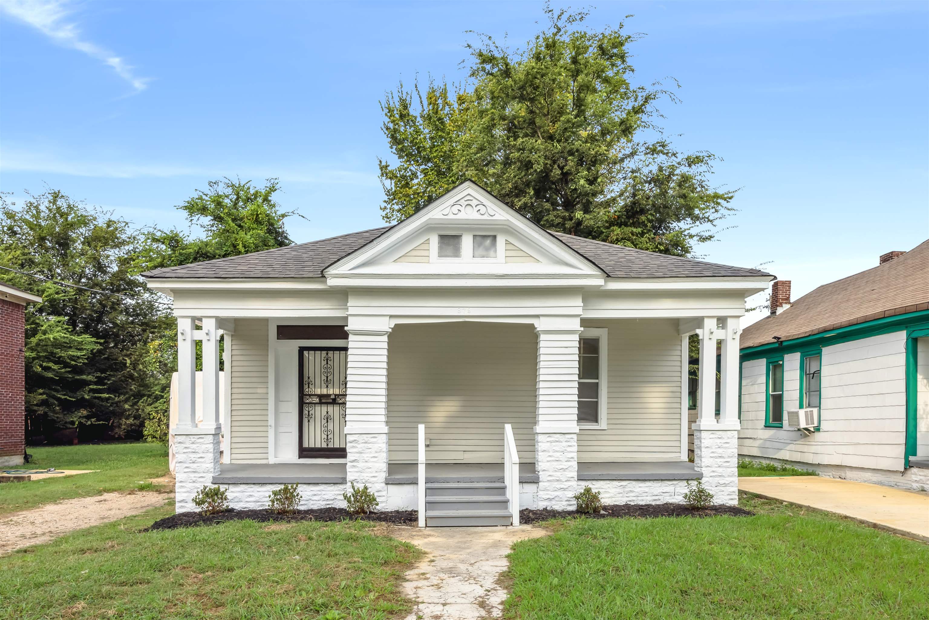 a front view of a house with a yard