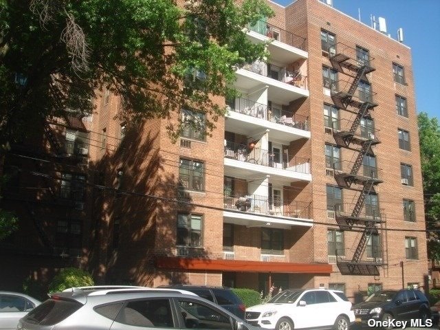 a front view of a building with lot of windows