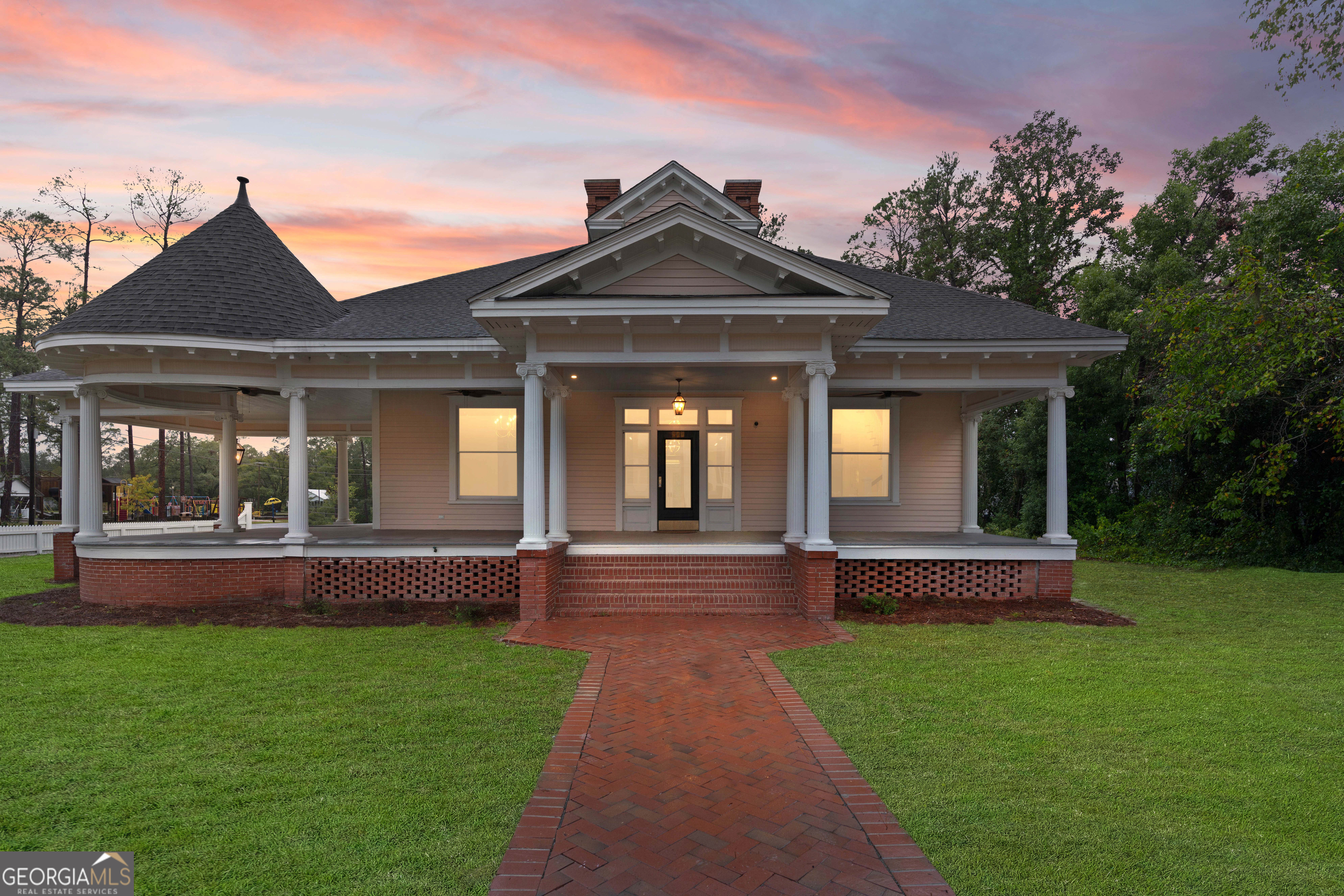 a front view of a house with a yard