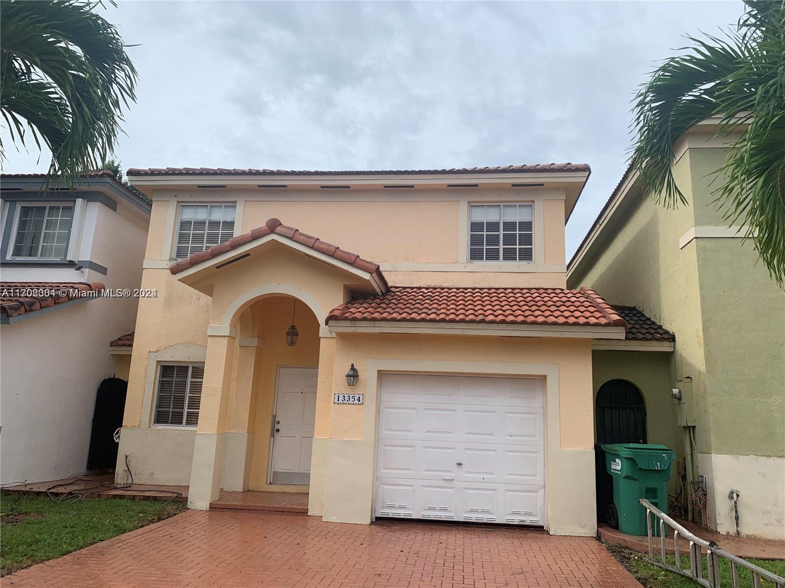 a front view of a house with a garage