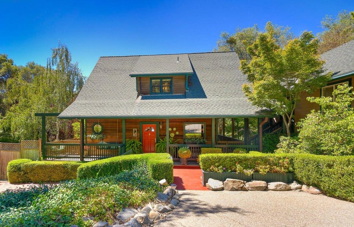 a front view of a house with garden