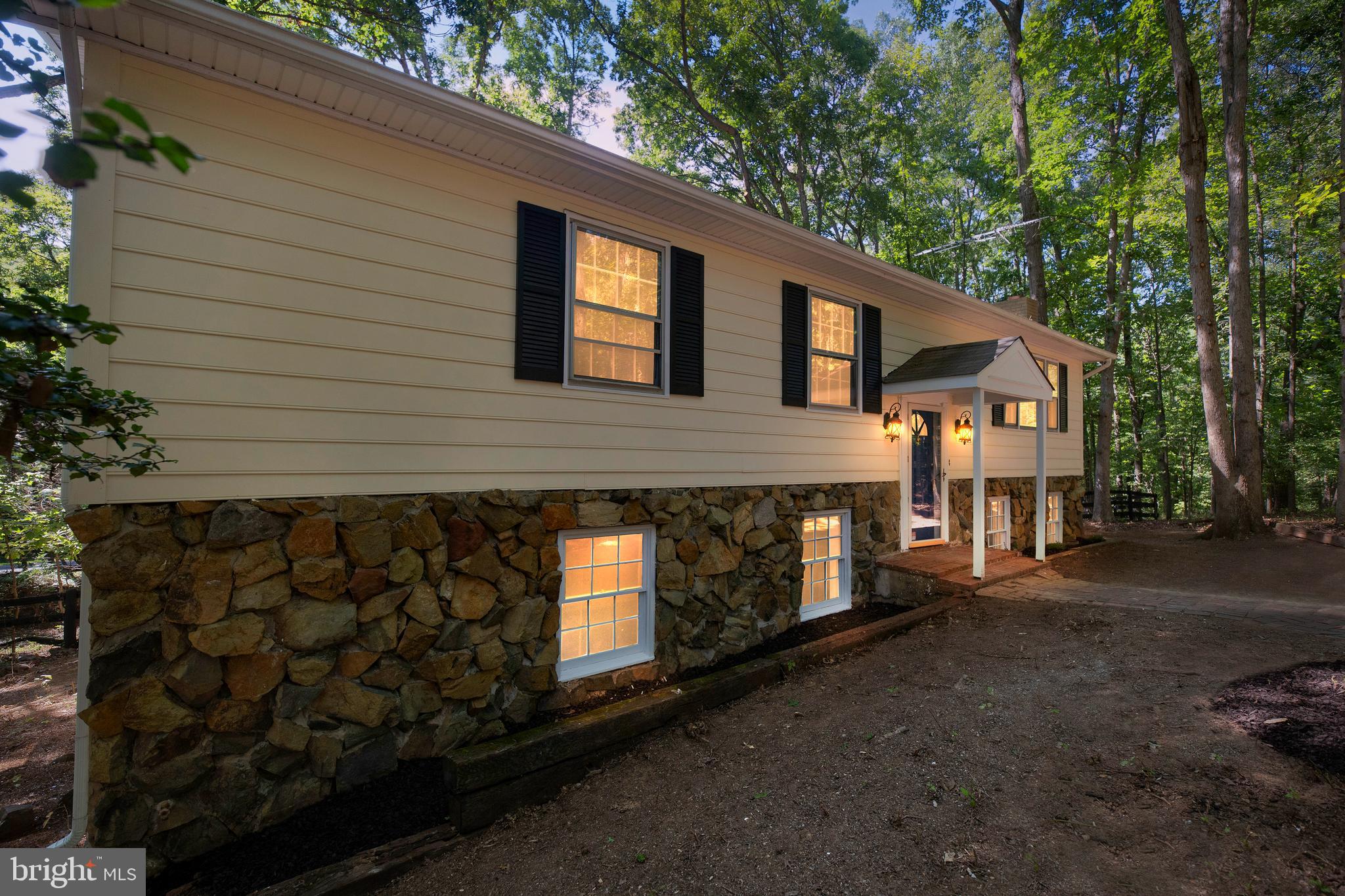 a front view of a house with yard