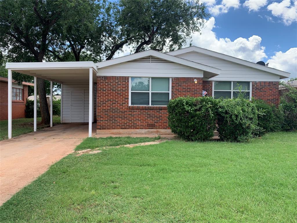 front view of a house and a yard