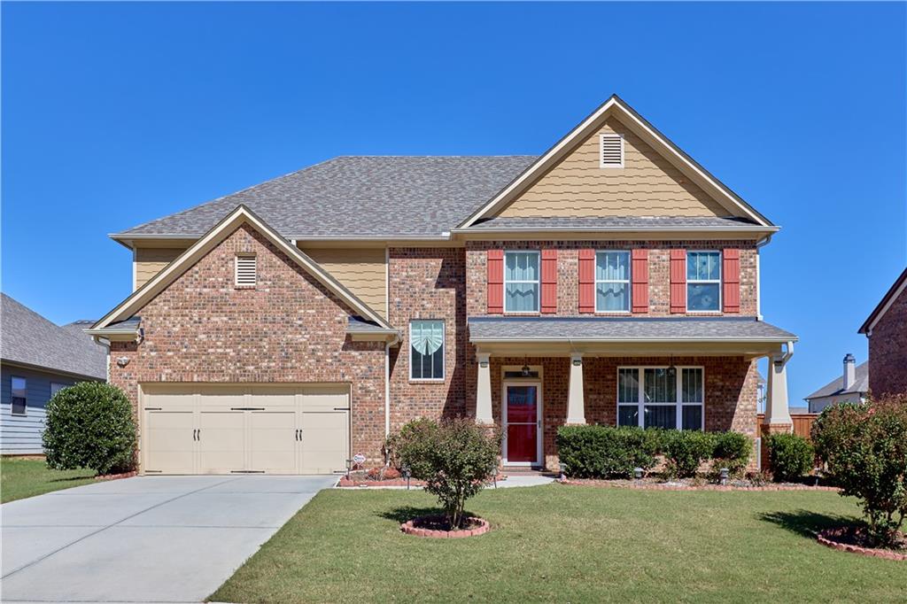 front view of a house with a yard