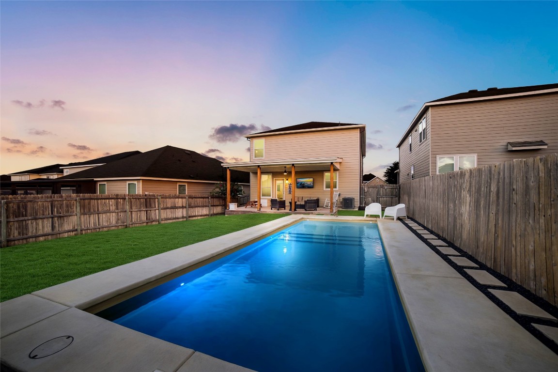 a view of swimming pool with a yard