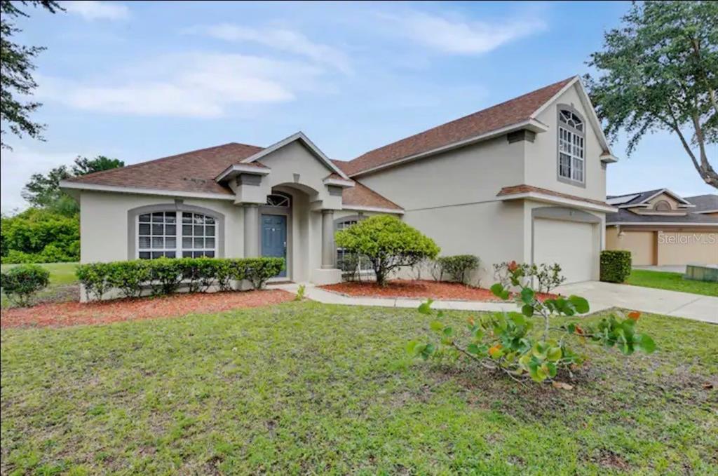 front view of a house with a yard