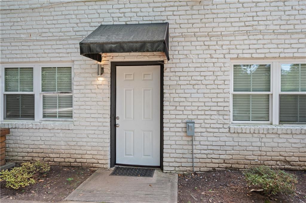 a brick house with a door and a door