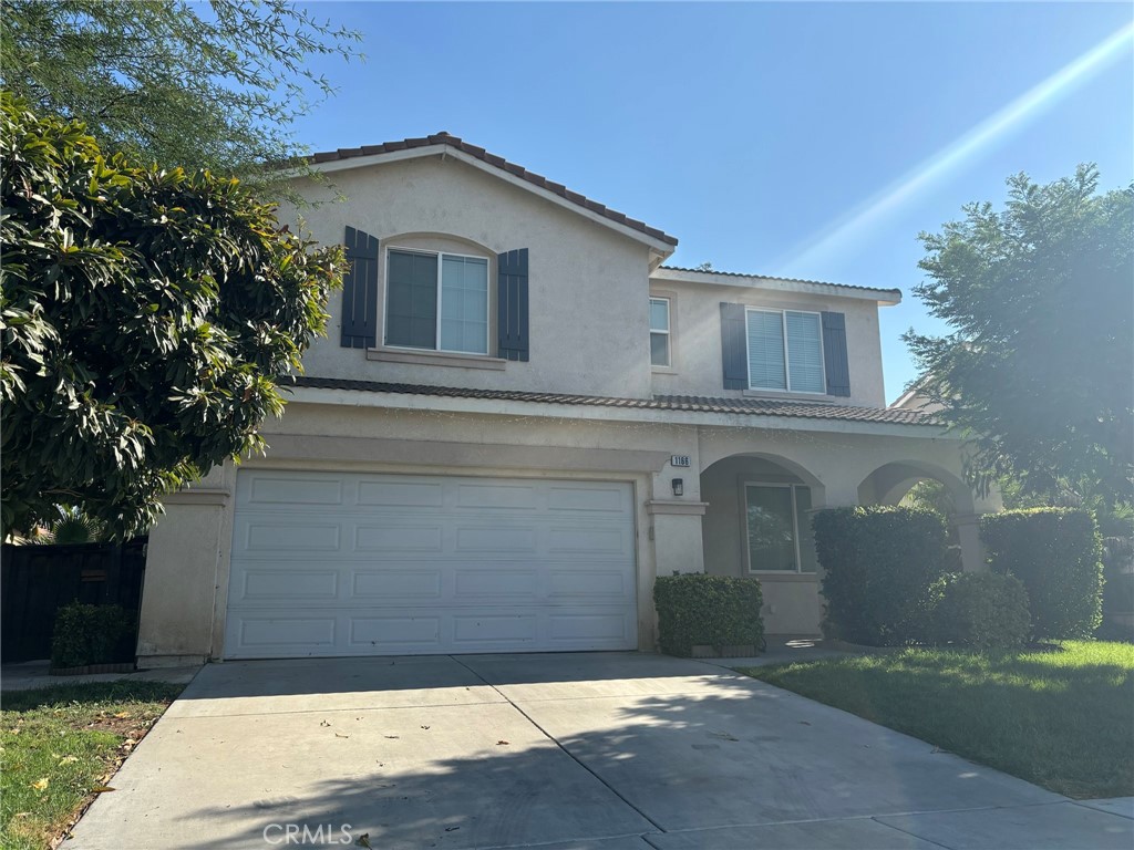 a front view of a house with a garage