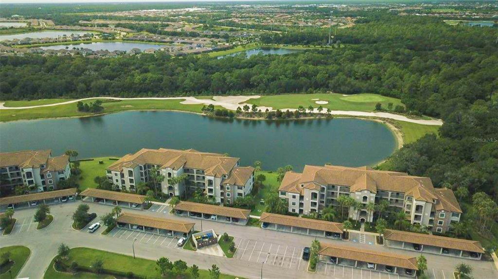 an aerial view of a house with a lake view