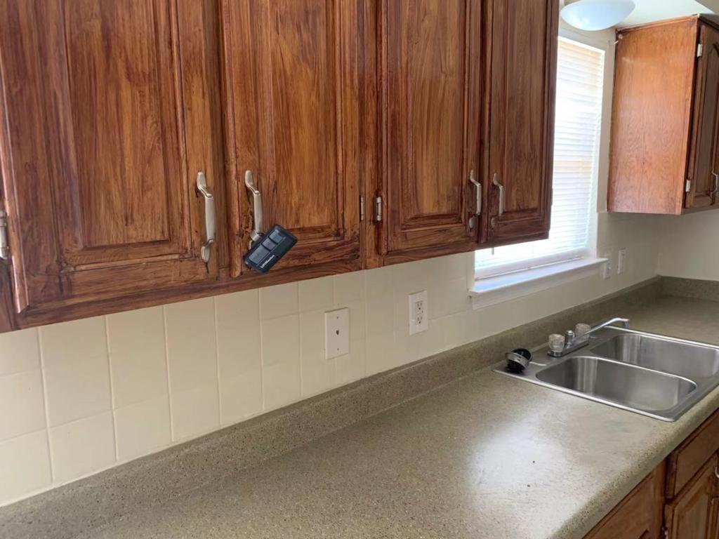 Kitchen with tasteful backsplash and sink