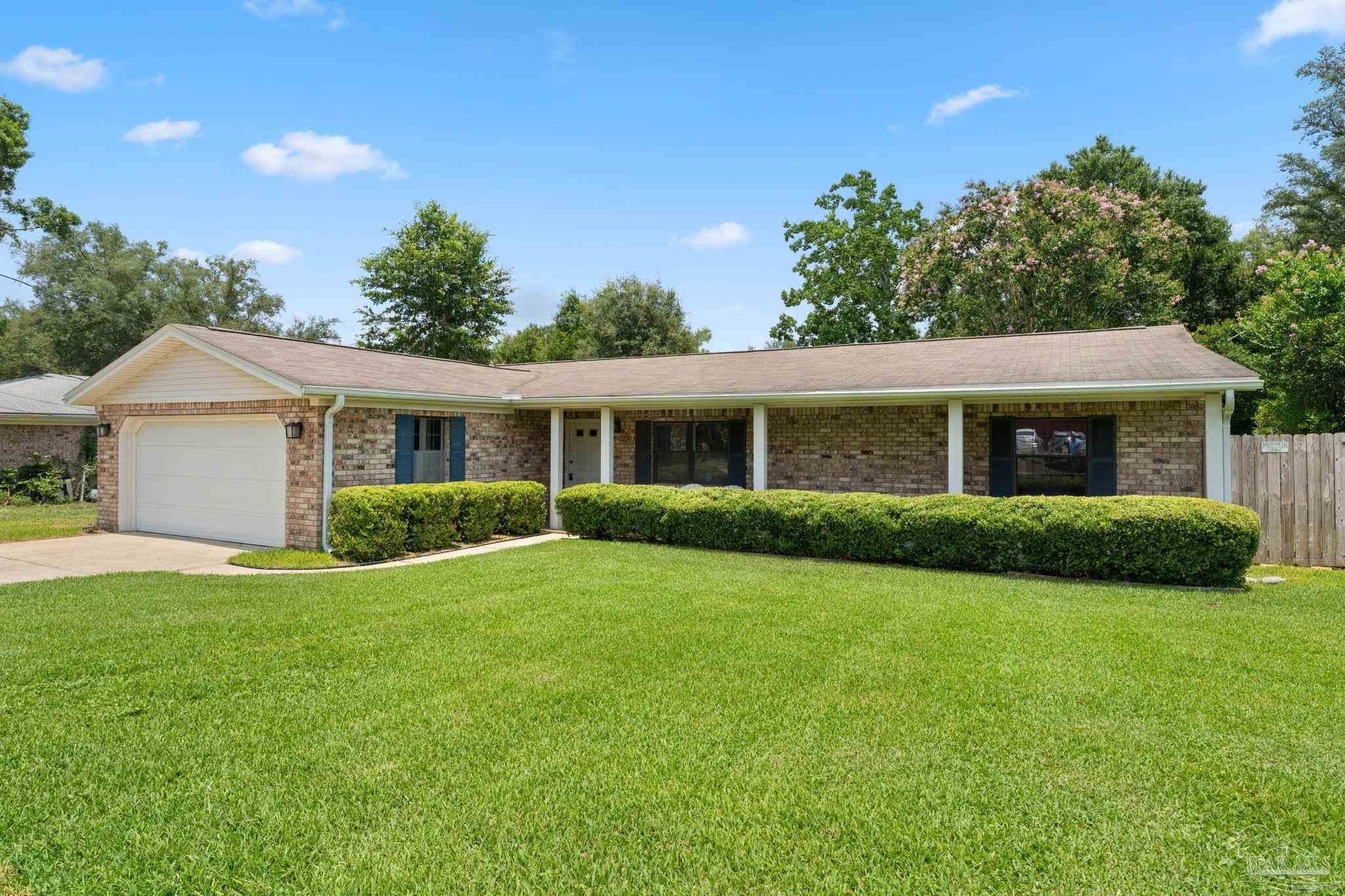 a view of a house with a yard