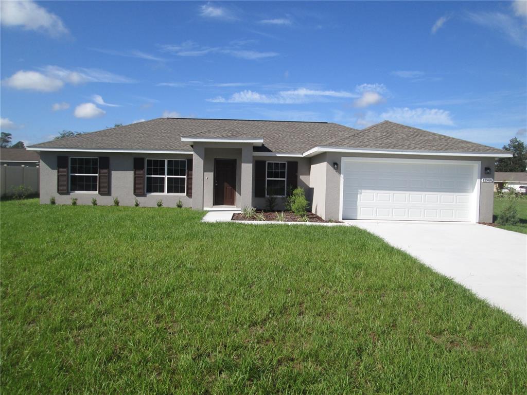 front view of a house with a yard