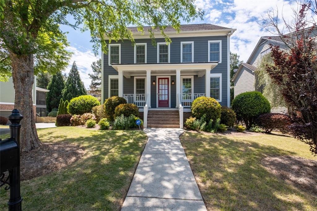 a front view of a house with garden