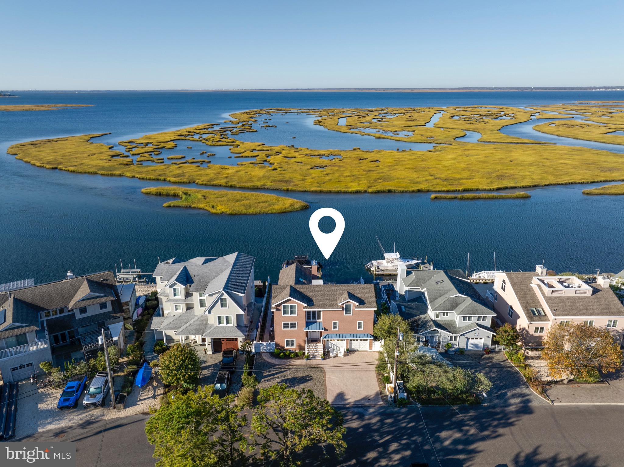 an aerial view of a house with a ocean view