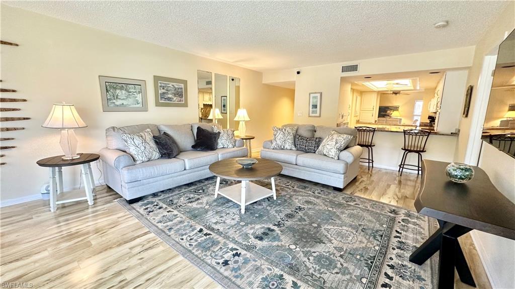 a living room with furniture and a table