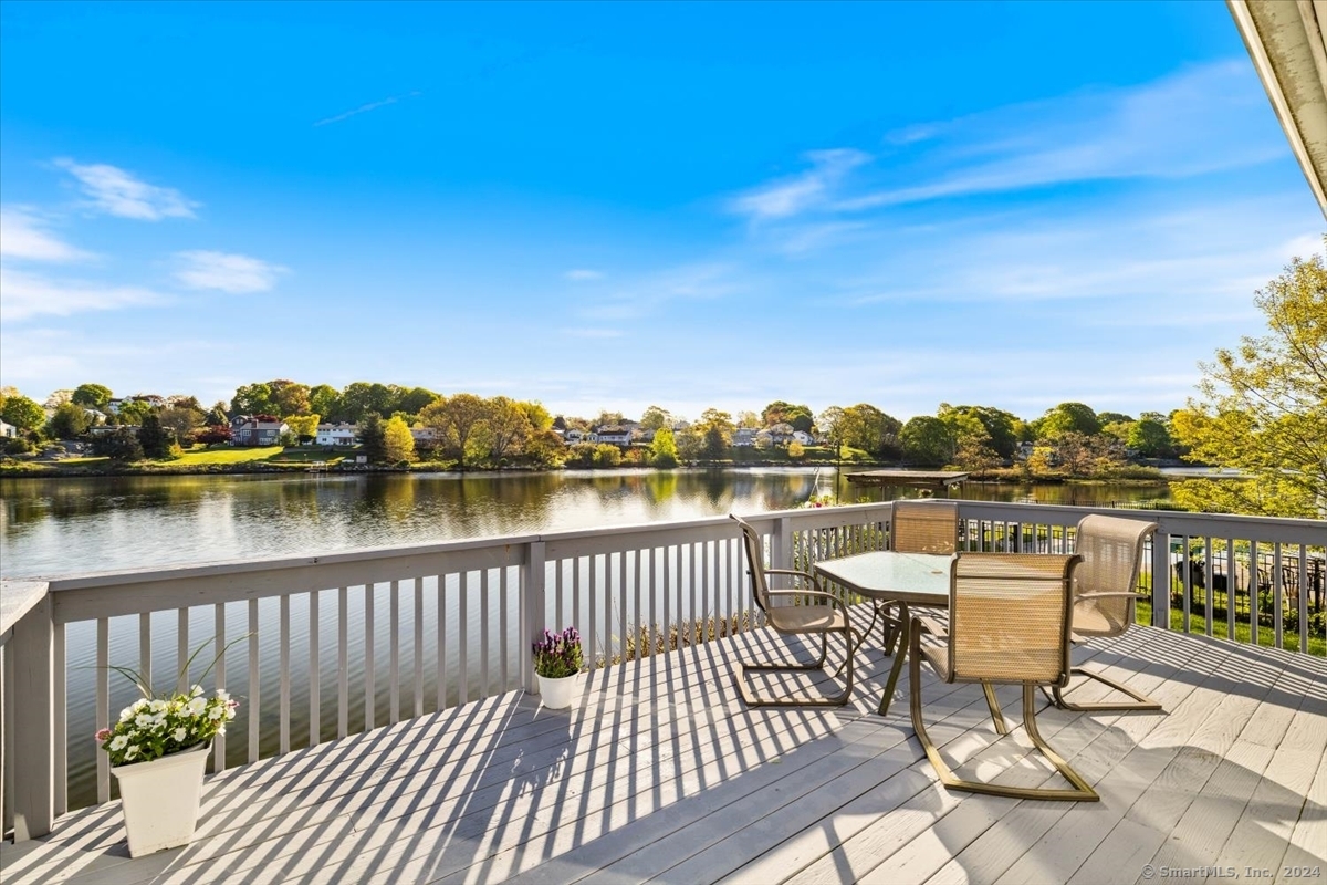 a view of a lake with outdoor seating